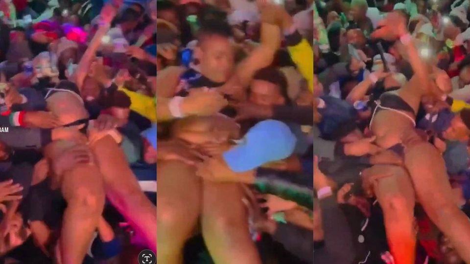 Video of female musician perfoming whiles crowd play with her body trends